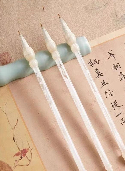 Chinese calligraphy brush set with small, medium and large brushes