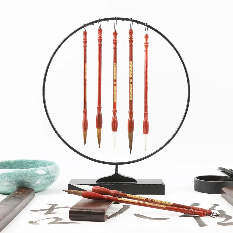 3-piece calligraphy brush set displayed on circular stand with inkstone and ink slab
