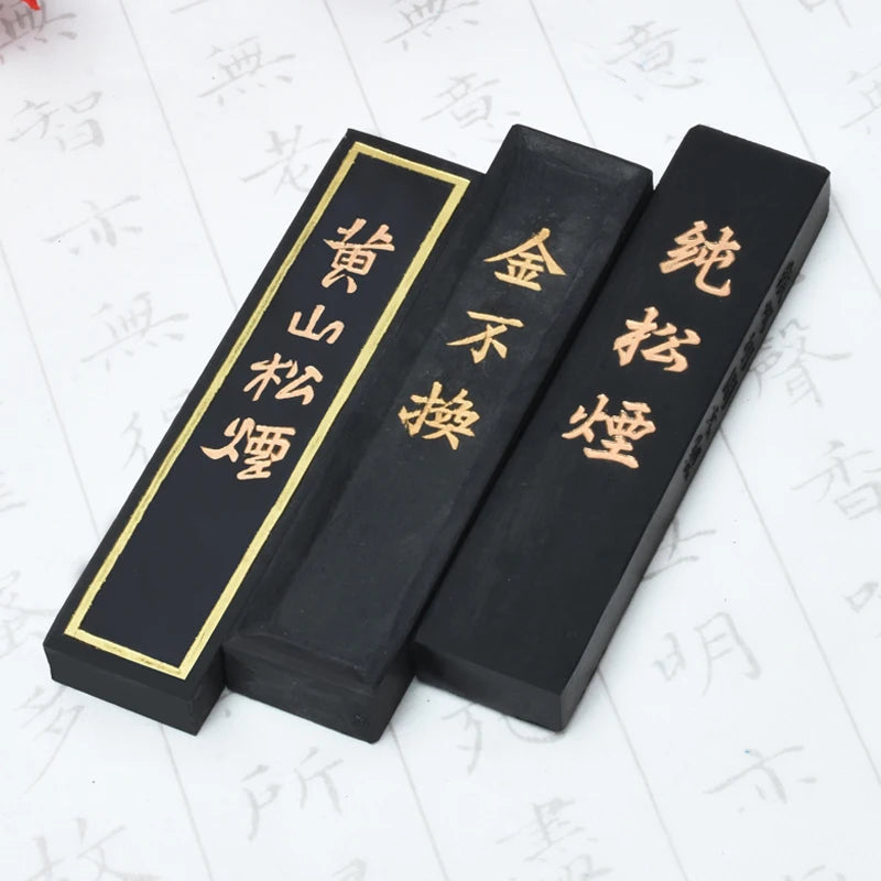 Pine smoke ink stick being ground on inkstone with water for calligraphy