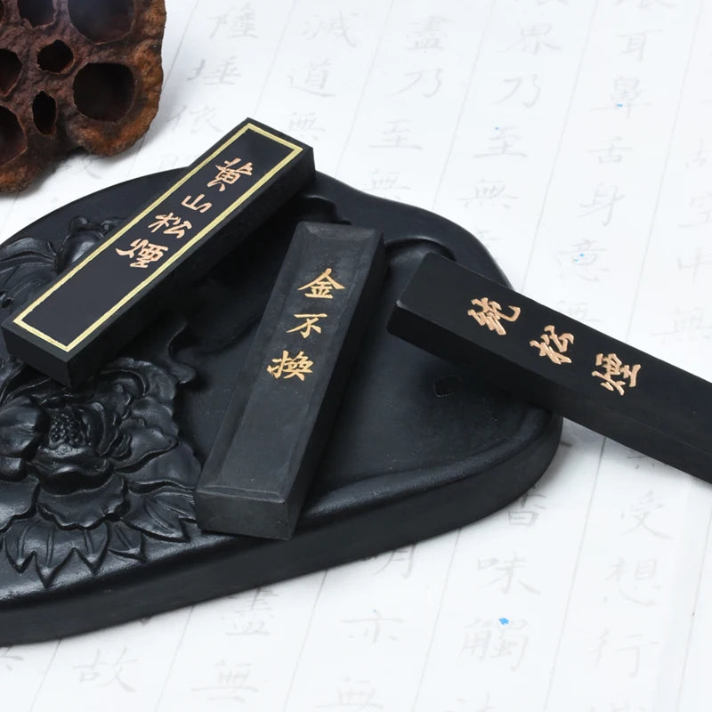 Top view of traditional pine smoke ink stick showing texture and finish