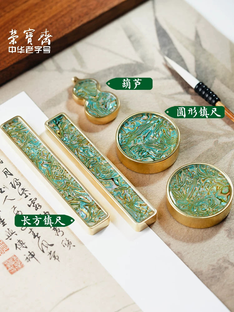 Close-up of mother-of-pearl inlay detail on Rongbaozhai solid brass paperweight