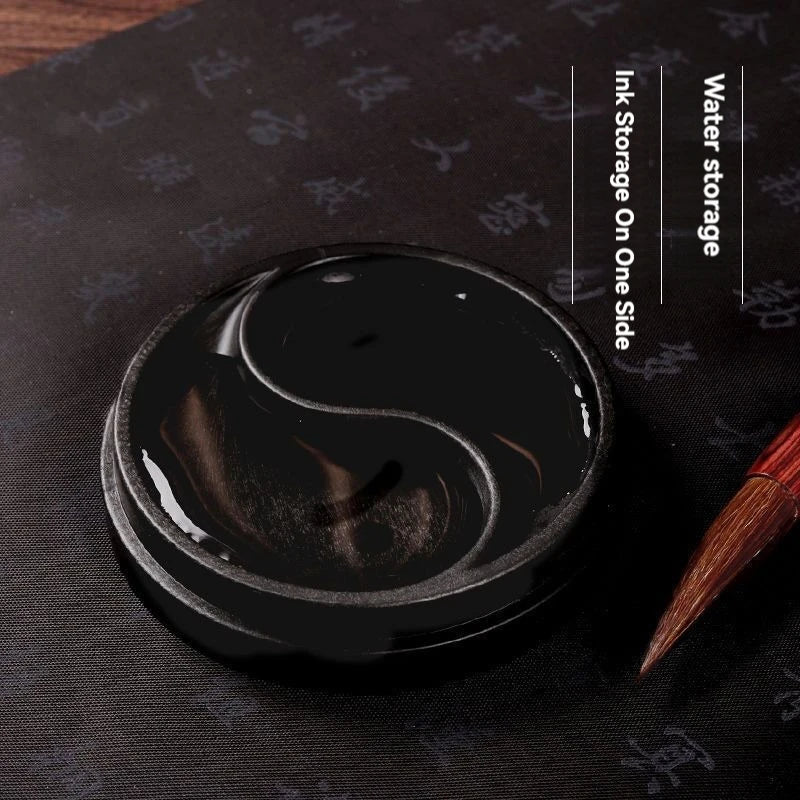 Ink being poured into Yin Yang Tai Ji calligraphy ink tray